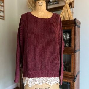 Pins and needles maroon sweater with lace trim at the bottom.